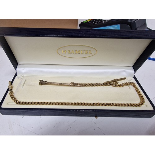 54A - 9ct gold propelling pencil unmarked tested. Has Metal top with stone and a gold plated fob chain