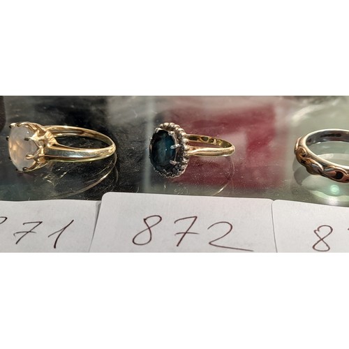 872 - 9ct gold dress ring set a blue stone