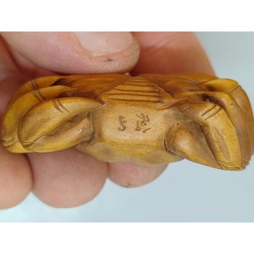 561 - Crab-netsuke figure, signed