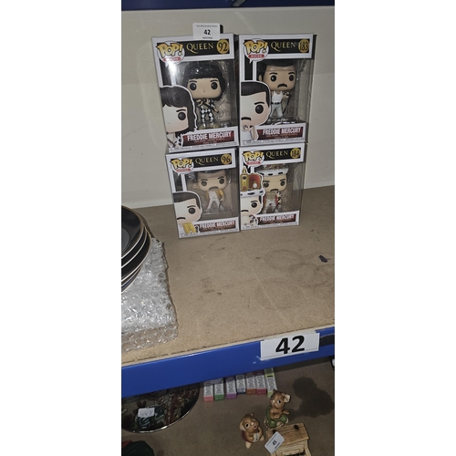 42 - 4 boxed Freddie Mercury figures