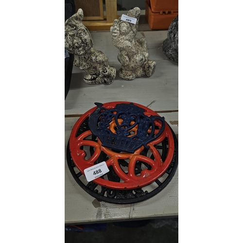 488 - 3 cast iron trivets