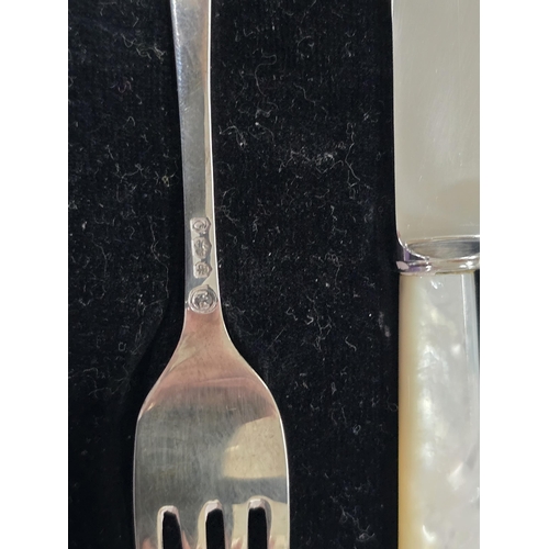 72 - silver hm Fork and MOP knife in case