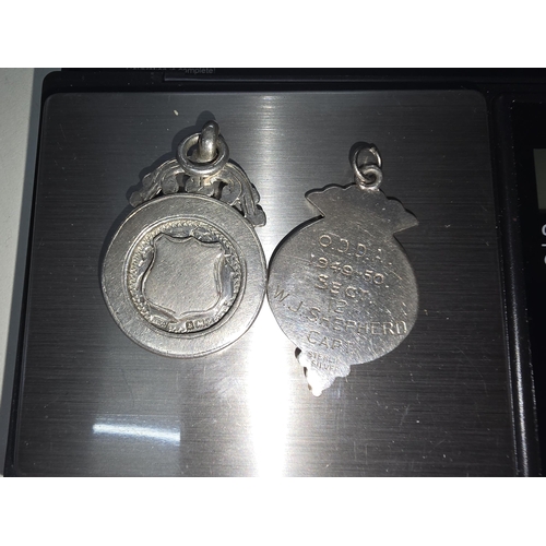 289 - Two silver hall marked fobs One Captain W J Shepard 1949 Lord Napier other 1949.