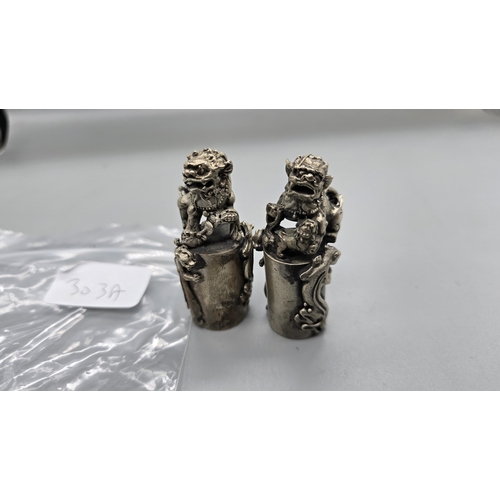 303A - early 20 grade silver pair of foo dog seals