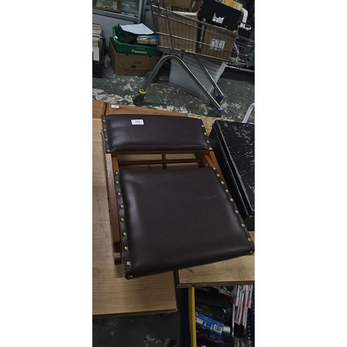 100 - LEATHER TOP ROCKING STOOL, FOLDS TO STORE