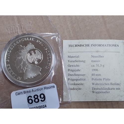 689 - German coin in capsule