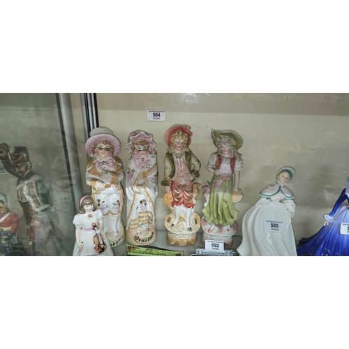 584 - Collection of bisque porcelain cabinet figures, including Grandad and Grandma pair