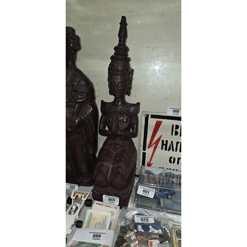 659 - Eastern carved wooden sculpture of praying temple dancer, 45cm height