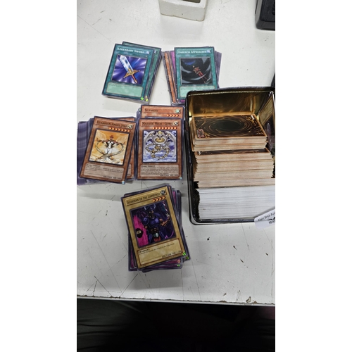 294 - A tin of 1st ed Yugiho Cards