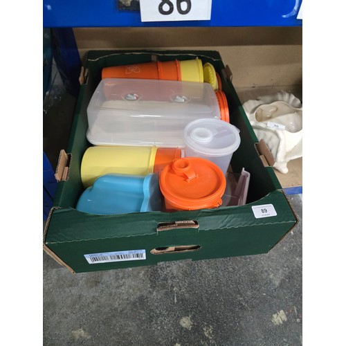 box of tupperware items etc