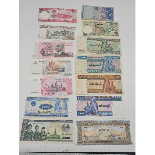 734 - 14 Asian banknotes, few in VGC