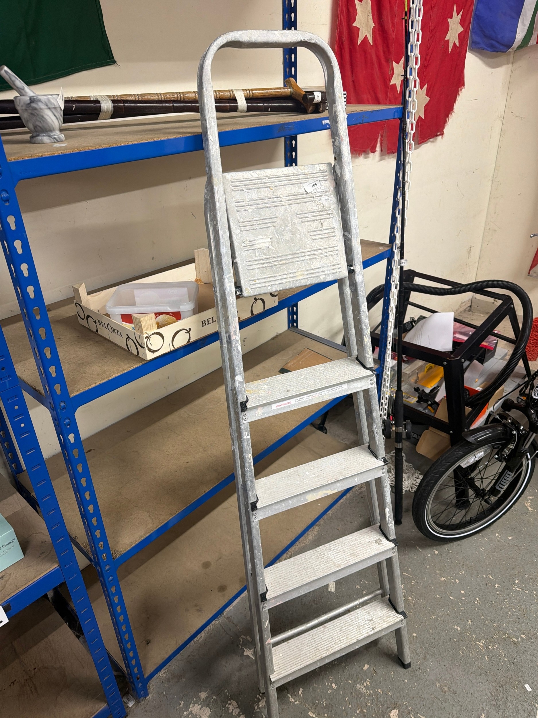 An Aluminum Five Tread Step Ladder