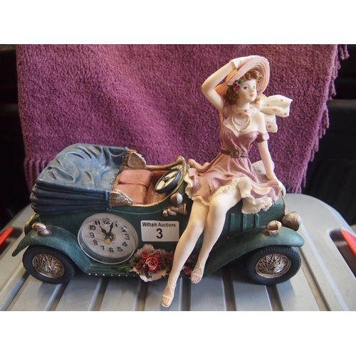 3 - Model car clock with lady figure sitting on bonnet