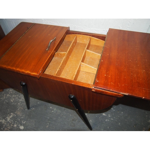 106 - A 1960’s teak sewing work box in a half moon design