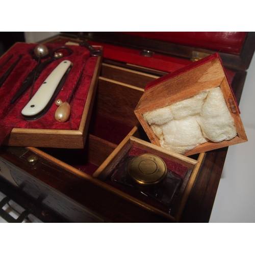 93 - An Edwardian mahogany ladies dressing / travel box with brass inlaid detailing with key and contents... 