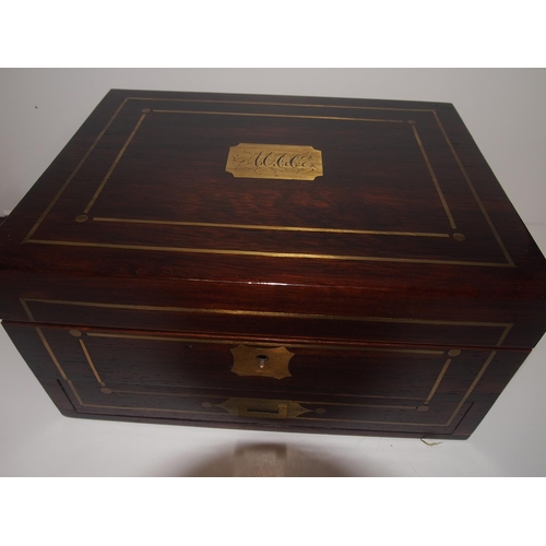 93 - An Edwardian mahogany ladies dressing / travel box with brass inlaid detailing with key and contents... 