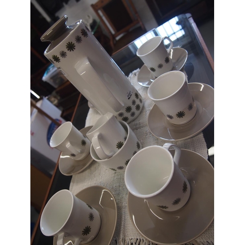 100 - A 1960's 'Allegro' coffee set by J & G Meakin, A/F to one cup