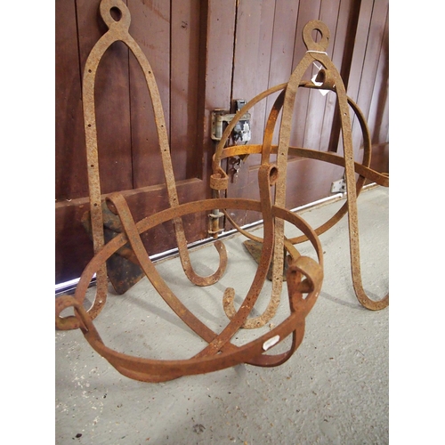 109 - A pair of vintage wrought iron medieval design wall baskets/planters and a pair of vintage hand desi... 