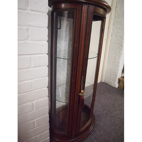 61 - An antique style mahogany oval display cabinet on brass feet, possibly French.  Decorative banding a... 
