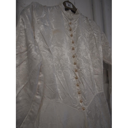 81 - A vintage handmade floral brocade wedding dress with long sleeves, high neckline design and pearl bu... 