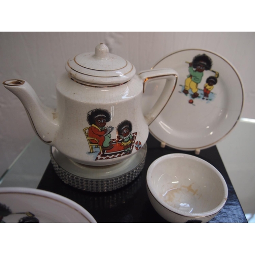 89 - Antique porcelain children's tea set with caricature design of mother and child sporting scenes A/F