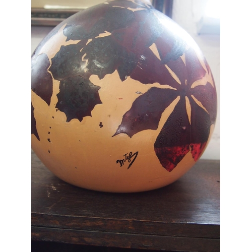 93 - A large vintage/retro French onion shaped glass bottle, hand painted with horse chestnut leaves and ... 