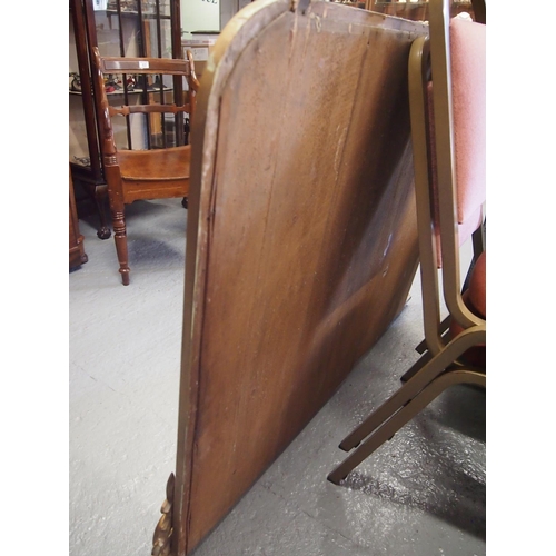 97 - An antique giltwood framed oval mantle mirror with hand carved scroll leaf design detailing