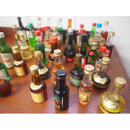 104 - A quantity of miniatures including brandy, vodka, liqueurs etc. (40 bottles in total) A/F