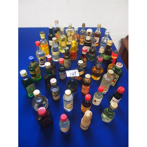 107 - A quantity of miniatures including brandy, vodka, liqueurs etc. (40 bottled in total) A/F