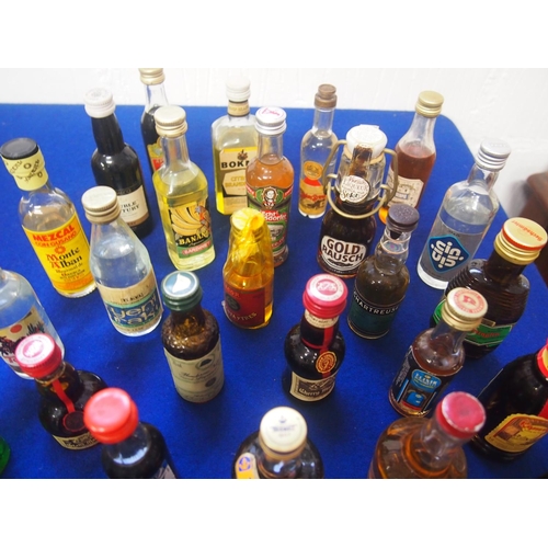 107 - A quantity of miniatures including brandy, vodka, liqueurs etc. (40 bottled in total) A/F