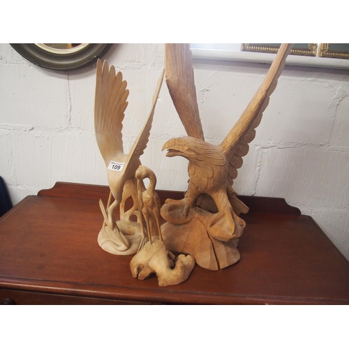 109 - A hand carved perched eagle together with two other wooden water birds