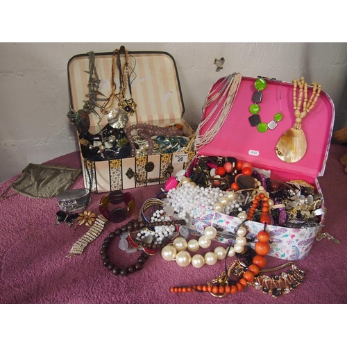 20 - Two cases containing a quantity of costume jewellery including bracelets, necklaces, rings, brooches... 