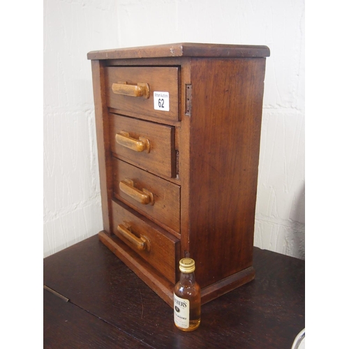 62 - A small rustic wooden four drawer cabinet, approx. size 30x16cm