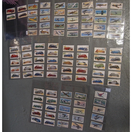 8 - A quantity of vintage vehicle themed items including John Player cigarette cards depicting aircraft ... 