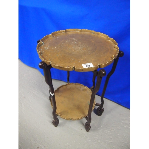 80 - A two-tier side table, with removal decorative brass trays