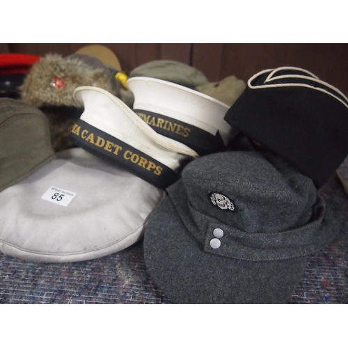 85 - A collection of military style caps, berets and hats, 20 items in total