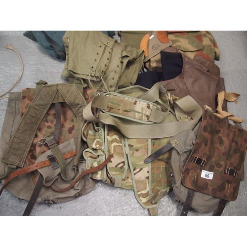 86 - A collection of camouflage military style bags plus other military style clothing etc.