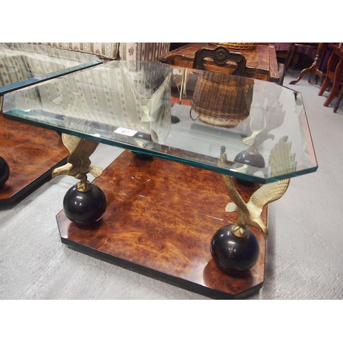 87 - A bevelled glass top square table with burr walnut design to base with Eagle perched on ball pedesta... 