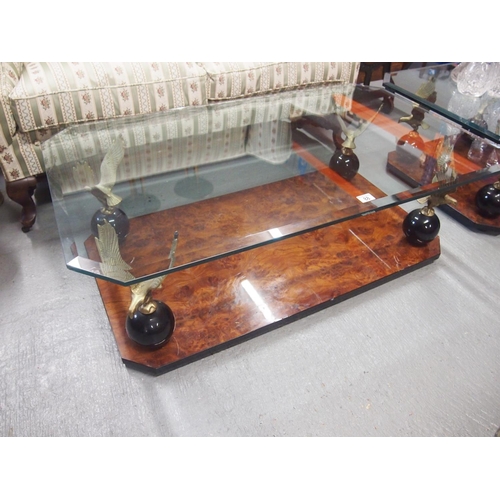 88 - A rectangular table with burr walnut design to base. The Eagles are perched on ball pedestals which ... 