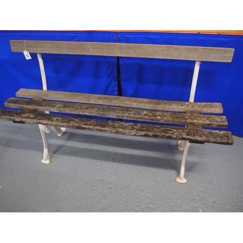 89 - A vintage slated wooden garden bench with cast iron supports, approx. size L127cm, D40cm, H47cm