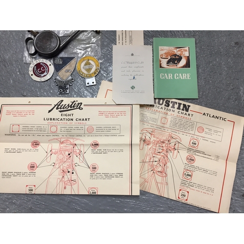 73c - A mixture of Motoring themed items including Motor Club / Caravan vehicle badges, a vintage oil can,... 