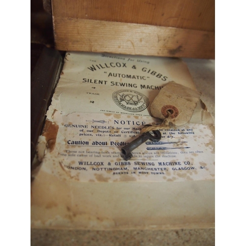 5 - Antique Willcox & Gibbs tabletop sewing machine with wooden case, original booklet and key