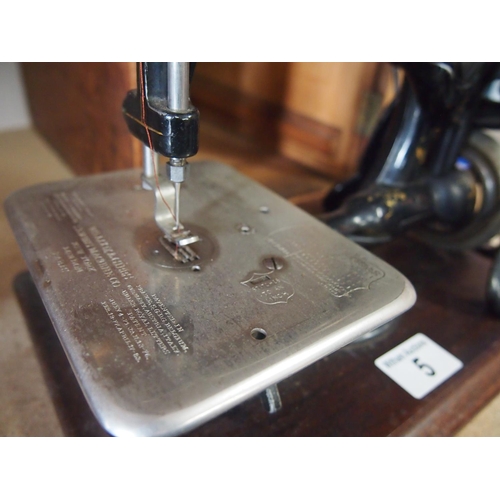 5 - Antique Willcox & Gibbs tabletop sewing machine with wooden case, original booklet and key