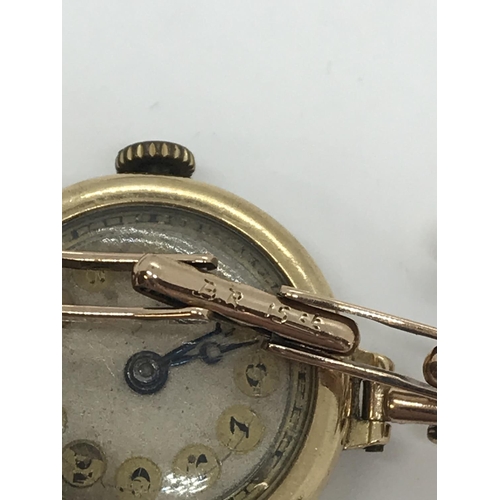 23 - A ladies yellow gold wristwatch, stamped 18 .75 94720 to case with expanding strap marked Britannic ... 