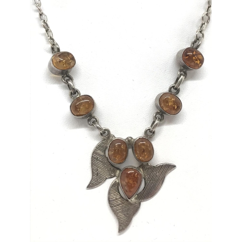 29 - A silver and amber necklace stamped 925, approx. chain length 16