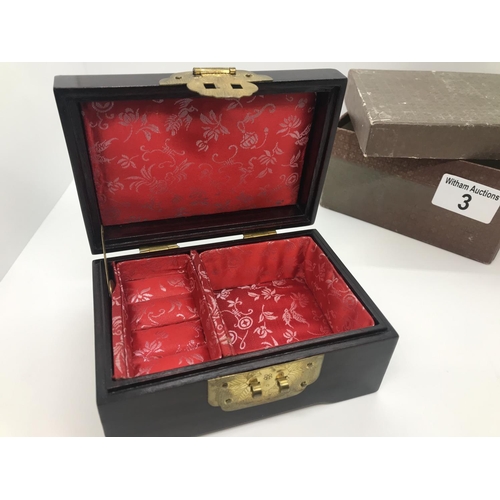 3 - An oriental wooden jewellery box with brass coloured clasps and carved jadeite /soapstone with carve... 