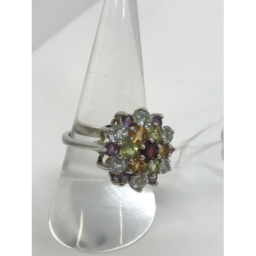 35 - A silver multi colour crystal ring stamped 925, approx. size O/P