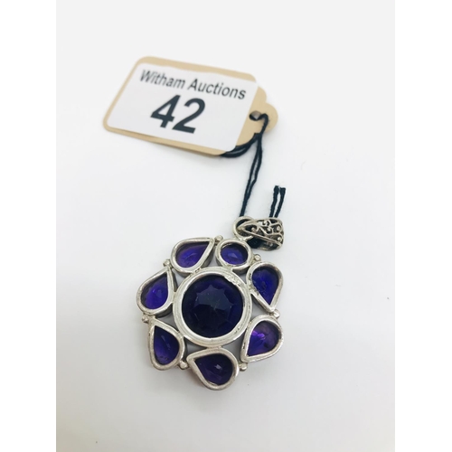 42 - Large cut amethyst and silver pendant, marked 925, approx. width 3cm