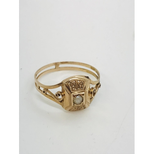 50 - A decorative pearl ring with scroll detailing to the mount, unmarked testing 18ct gold, approx.  gro... 