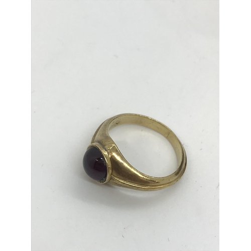 51 - A yellow gold ring with ruby/garnet, unmarked tested 14ct, approx size P, total gross weight approx.... 